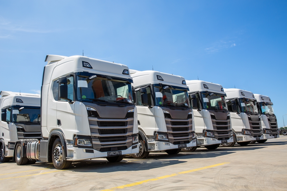 Well-organized fleet of trucks highlighting effective fleet management systems