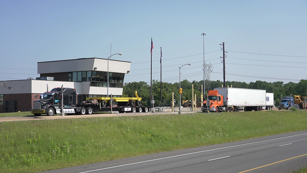 Trucks at a weigh station. CSA scores are vital for fleets to remain compliant.